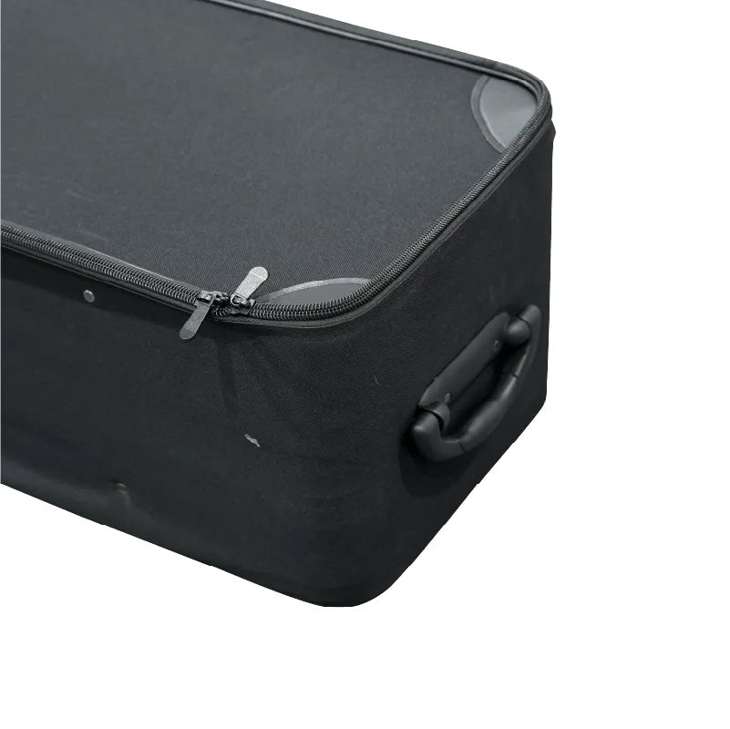 Close-up of the molded side handle, dual zipper pulls and reinforced corner of a large hard case